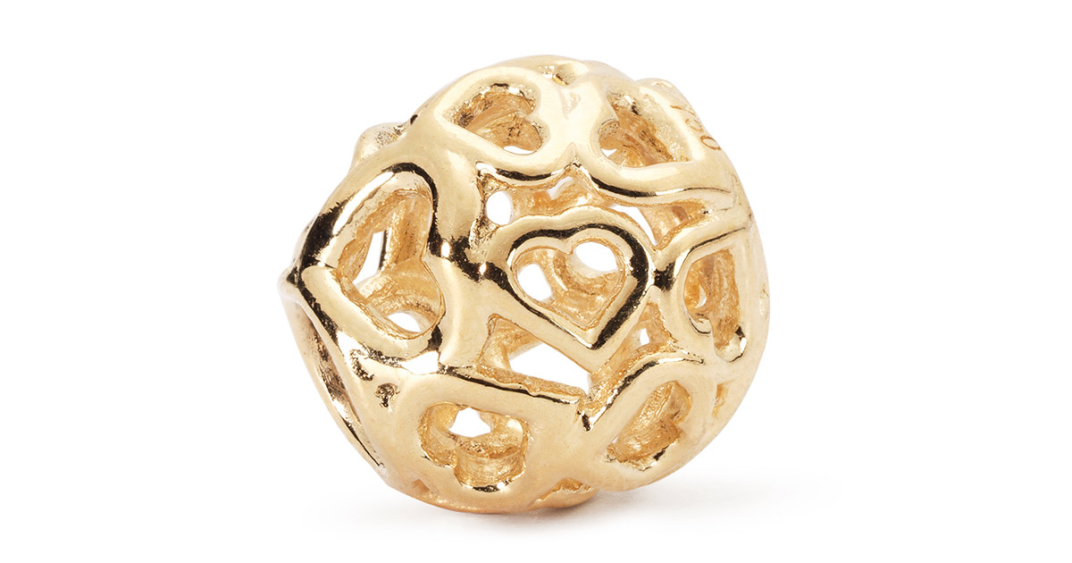 Ein Bead-Motiv für das Hochzeitsarmband von Trollbeads: Das Herz- Bouquet in Gold.