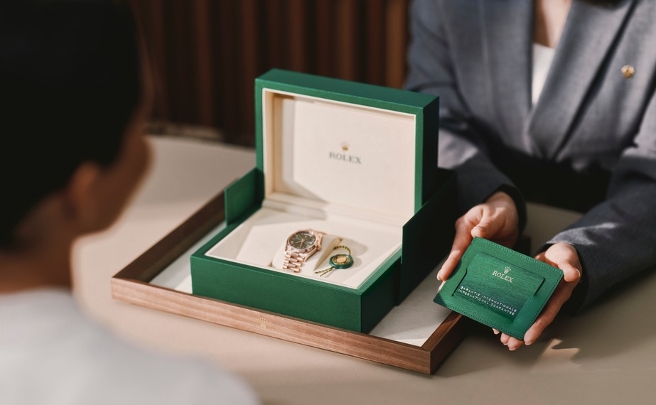 Rolex Uhr in grüner Geschenkbox mit Garantiekarte