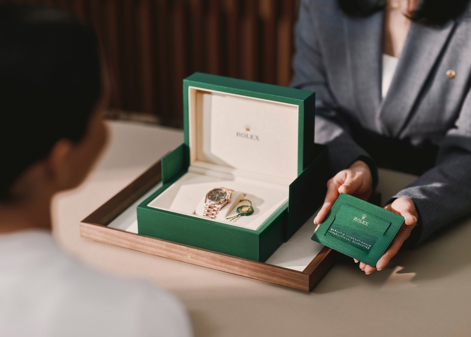 Rolex Uhr in grüner Geschenkbox mit Garantiekarte